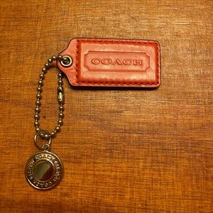 Coach leather key chain with decorative tag